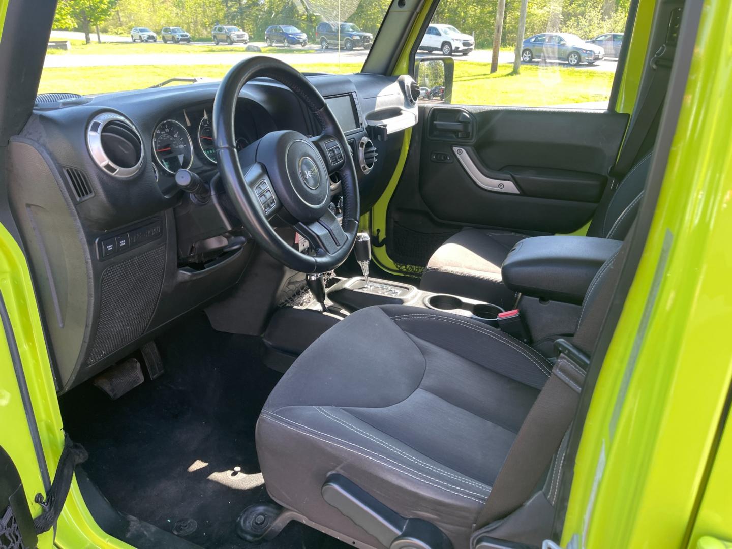 2017 Green /Black Jeep Wrangler Unlimited Rubicon 4WD (1C4BJWFG2HL) with an 3.6L V6 DOHC 24V engine, 5-Speed Automatic transmission, located at 11115 Chardon Rd. , Chardon, OH, 44024, (440) 214-9705, 41.580246, -81.241943 - This 2017 Jeep Wrangler Unlimited Rubicon is a rugged and capable off-road vehicle, equipped with a range of premium features. The exterior boasts LED headlights and fog lights, while the interior features a single-zone automatic climate control system, a 9-speaker Alpine sound system, and navigatio - Photo#15